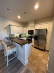 Full kitchen with countertop seating for 2